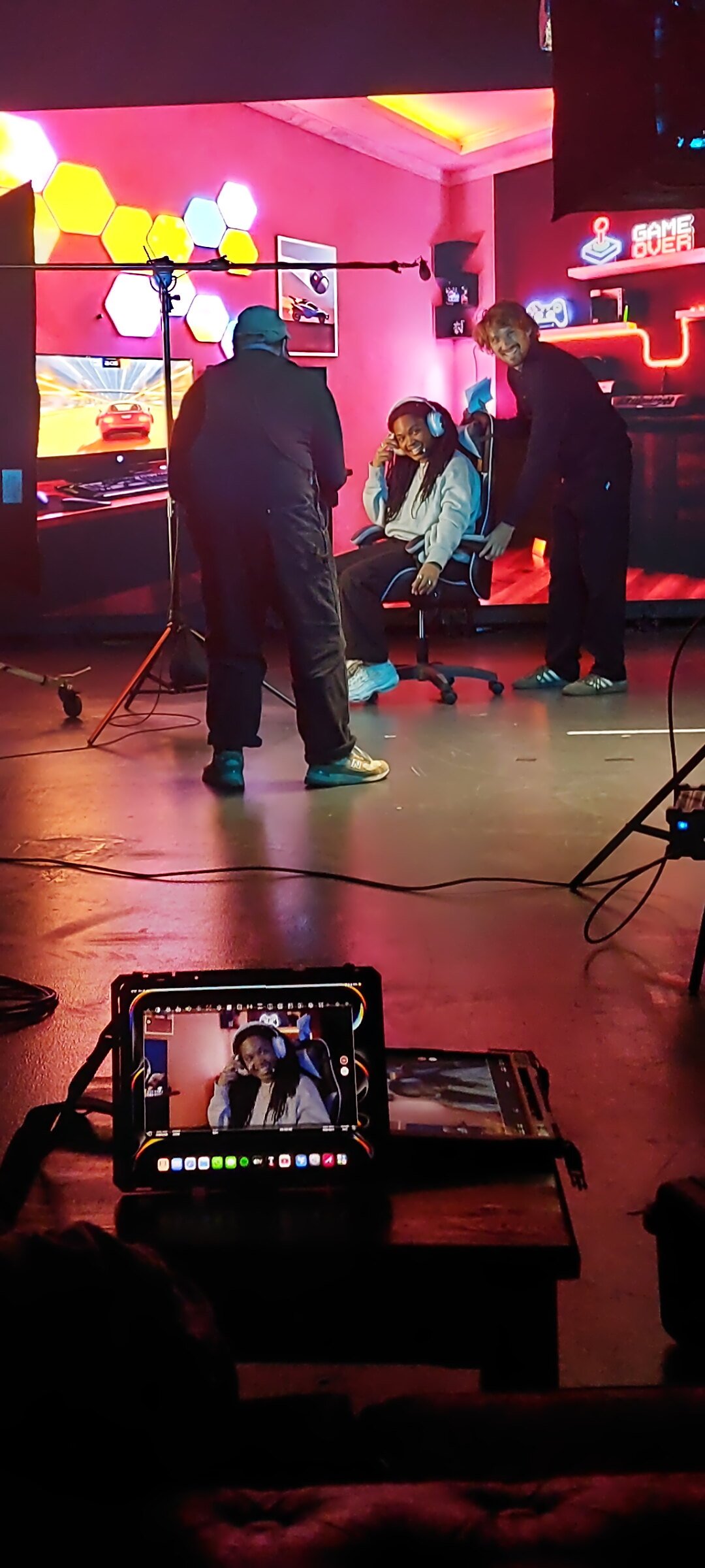 Alanis smiling in a gaming chair on a studio video shoot